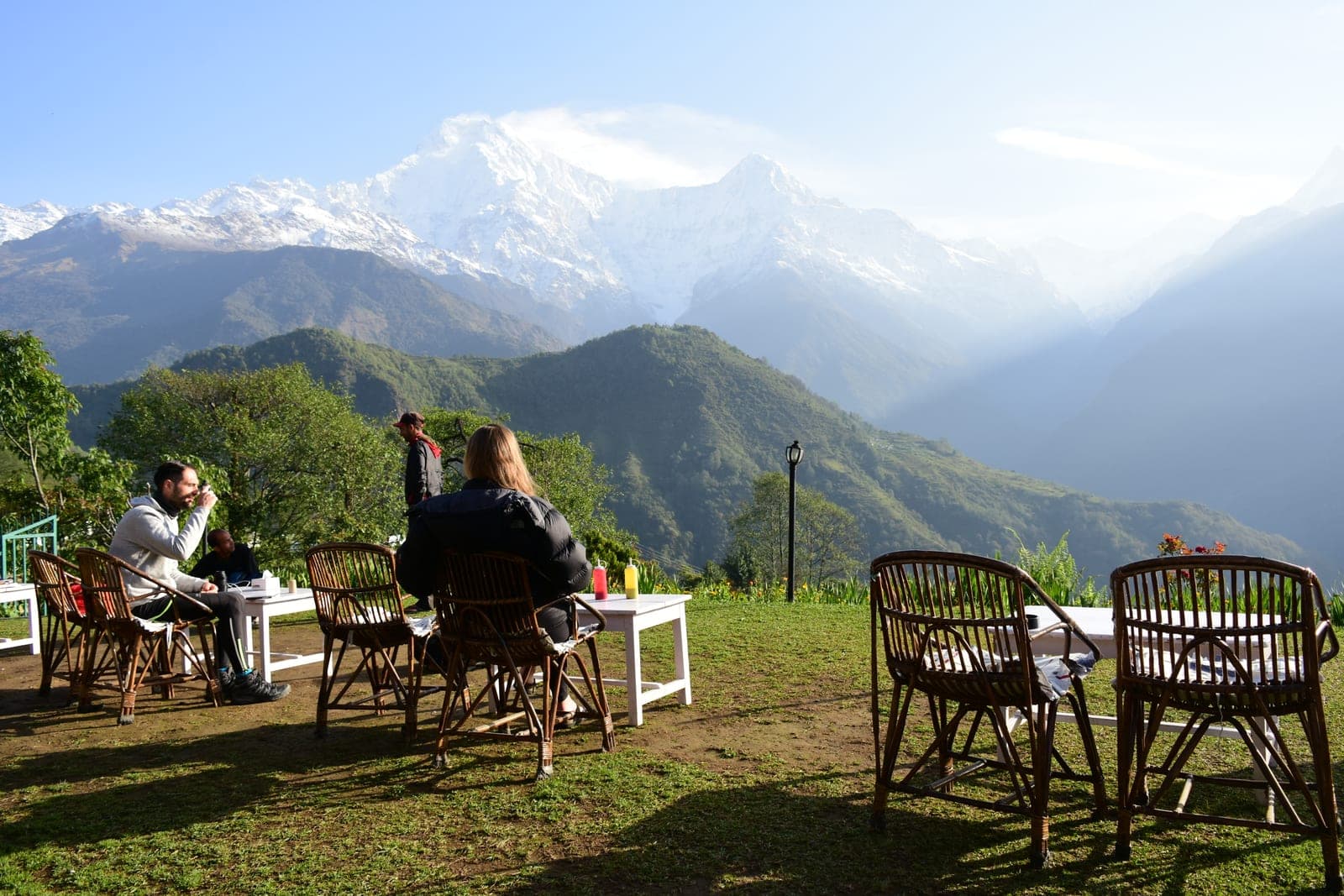 Morning tea in a teahouse garden below Annapurna South and Machhapuchhre